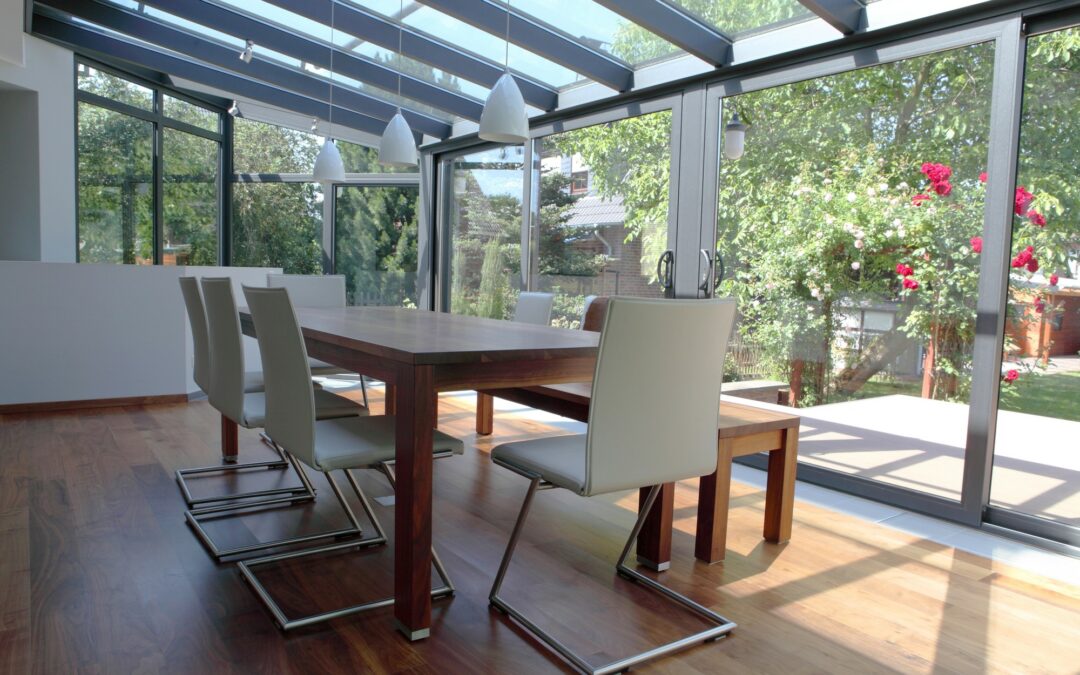 indoor dining room showing dining room table with chairs in a sunroom